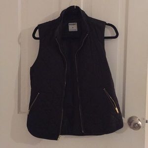 Black vest with gold accents